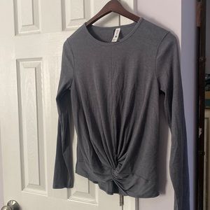 Brand new long sleeved t-shirt with twist front. Snug fitting.